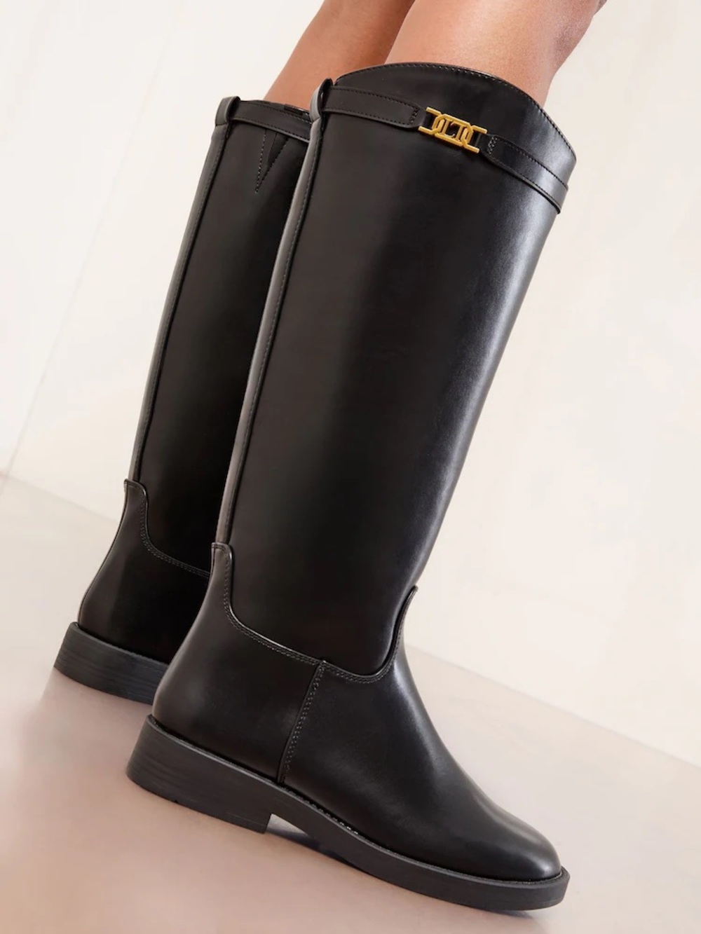 Black Leather Knee-High Riding Boots with Gold Accent leather
